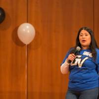 Image of Vanessa from TRIO Teacher Prep emceeing the event